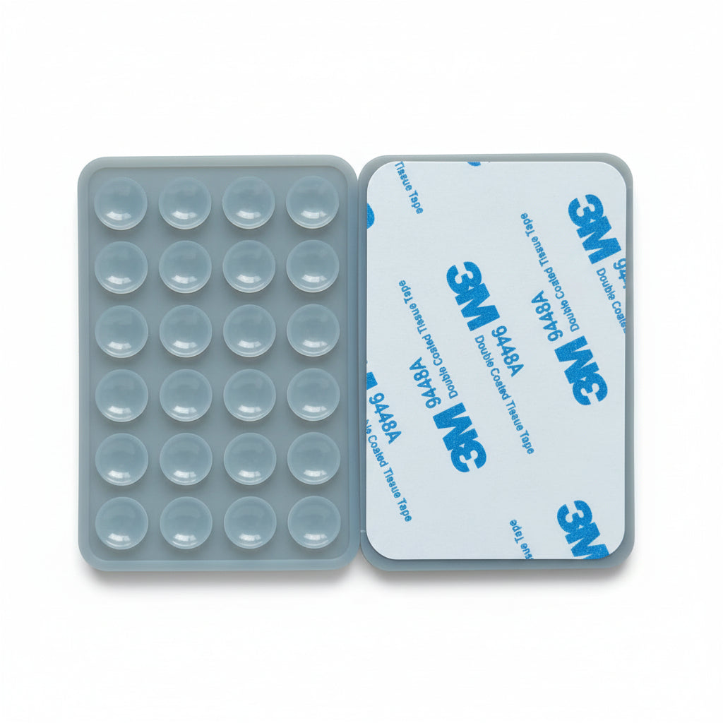Silicone mold with circular cavities and 3M adhesive strip on a cardboard background