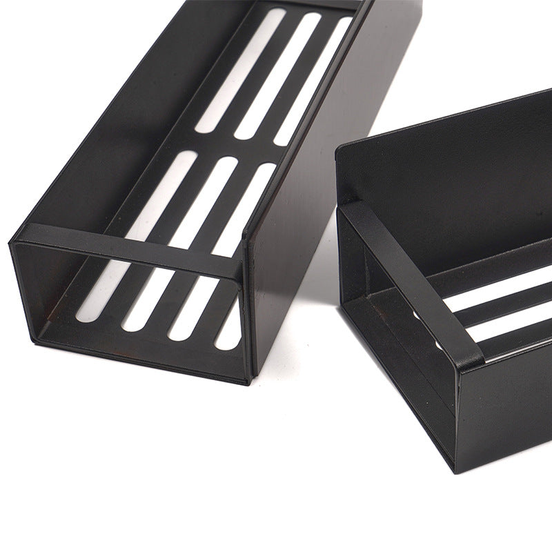 Two black metal shelves with slotted design on a white background