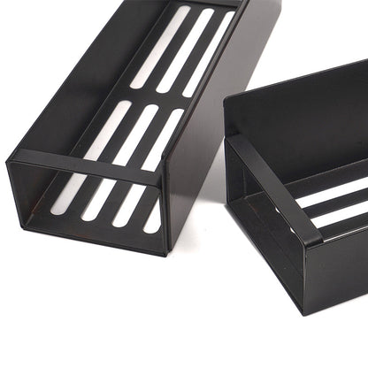 Two black metal shelves with slotted design on a white background