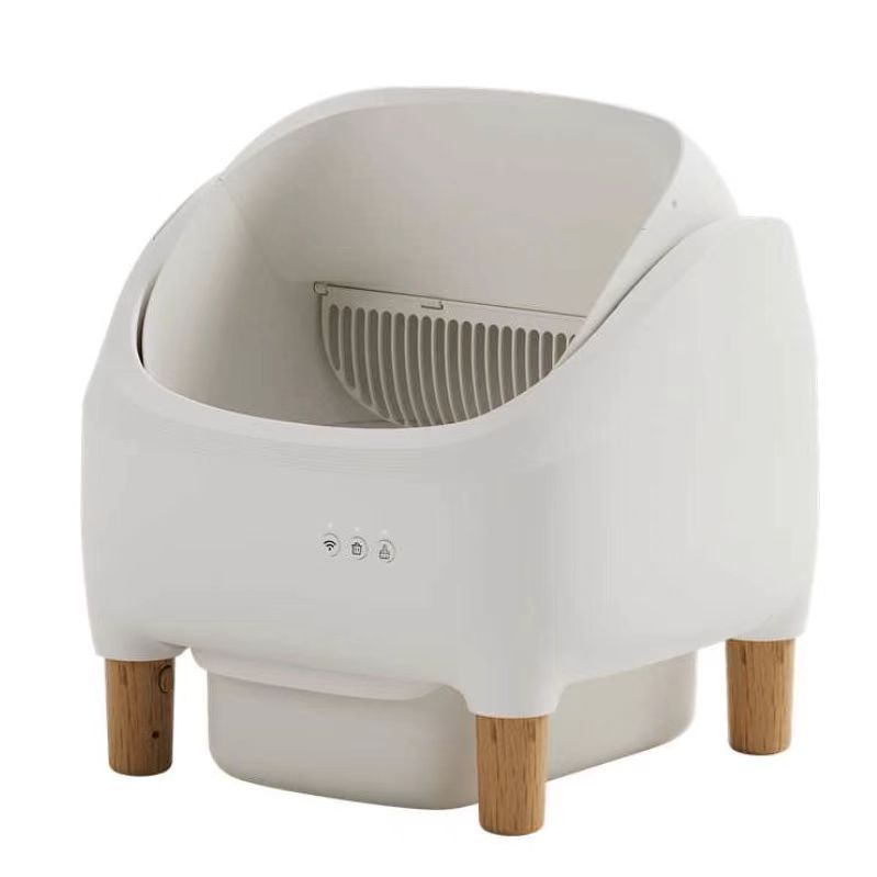 White pet litter box with wooden legs on a white background